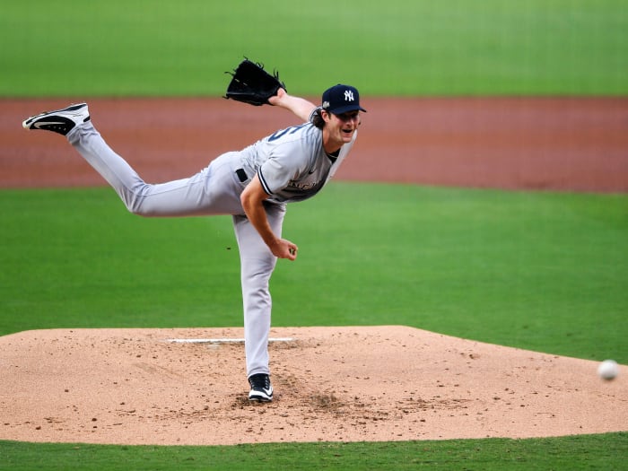 Oct 5, 2020; San Diego, California, USA; New York Yankees starting pitcher Gerrit Cole (45) pitches against the Tampa Bay Rays during the first inning in game one of the 2020 ALDS at Petco Park.